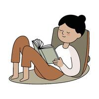 A woman reading a book while sitting on the floor vector