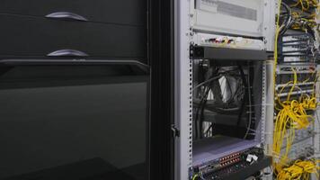 Industrial data center with computer place. Stock footage. Wall with computer wires and systems. A lot of wires for computer database of industrial center video