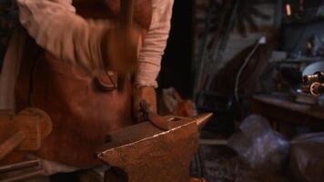 Turning iron. Media. Processionals work to shape the iron in with special hammers. video