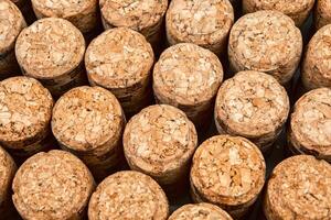 Background from textured wine corks, top view. place for text photo