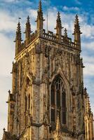 Stone Cathedral Tower with Arched Window in York, North Yorkshire, UK. photo