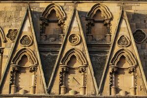 Stone Wall with Triangular Arches and Sundial in York, North Yorkshire, UK. photo