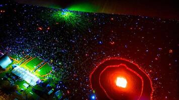 Aerial View of Crowd Around Bonfire at Night photo
