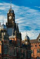 Brick Building with Clock Tower and Blue Sky in York, North Yorkshire, UK. photo