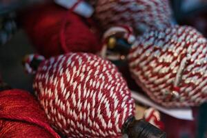 Red and White Twine Wound on Wooden Spool photo