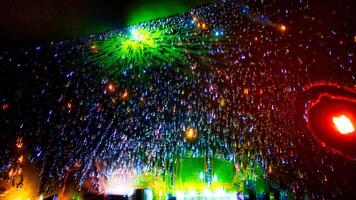 Crowd Holding Light Sticks at Night photo