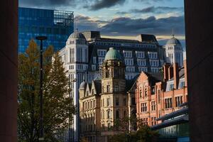 Urban Skyline with Glass, White, and Red-Brick Buildings photo