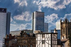 Modern and Historic Buildings in a City Skyline photo