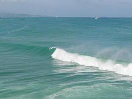 Bodyboarder about the take a big right wave in VVF, tartane, martinique, west indies, France photo