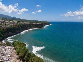 Waves breaking in front of Basse-pointe cemetary and in front of the ocean, Martinique, West Indies, France photo