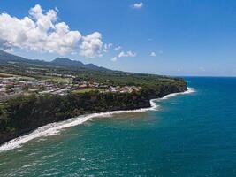 Coastal village on a cliff over the ocean at basse-pointe, Martinique photo