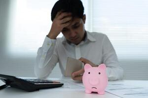 Stressed and headache man no pocket money , No money to pay to expenses and credit card debt. shortage, Financial problems, mortgage, loan, bankruptcy, bankrupt, poor, empty wallet, fall, down, poor photo