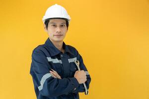 Engineers wear safety on color back ground. The inspectors crossed their arms proudly in the engineer project that they took the responsibility of inspecting. Service photo