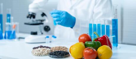 Scientist check chemical food residues in laboratory. Control experts inspect quality of fruits, vegetables. lab, hazards, ROHs, find prohibited substances, contaminate, Microscope, Microbiologist photo