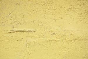 A Textured Yellow Wall Background Perfect for Various Design Projects and Inspirations photo