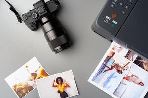 Printer and photo camera on table. Printing photos concept