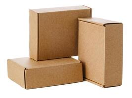 Stacked brown cardboard boxes in various sizes arranged on a white background photo