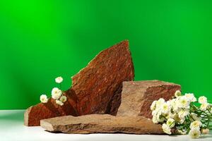 Mock up stone podium against green background photo