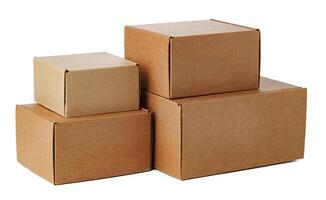 Stacked brown cardboard boxes in various sizes arranged on a white background photo