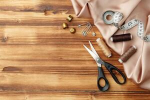 Crafting tools and materials arranged on a wooden table for sewing projects photo