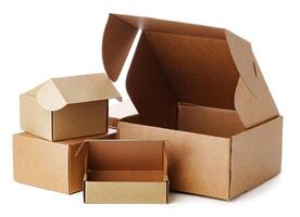 Stacked brown cardboard boxes in various sizes arranged on a white background photo