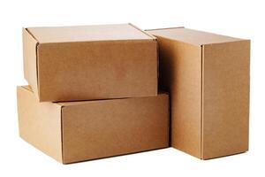Stacked brown cardboard boxes in various sizes arranged on a white background photo