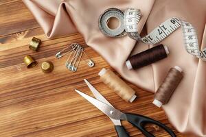 Sewing tools and materials arranged on soft fabric showcasing essential crafting supplies for creative projects photo