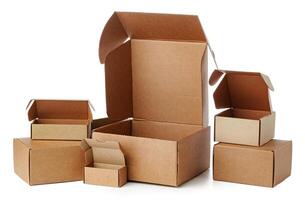 Stacked brown cardboard boxes in various sizes arranged on a white background photo