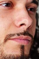 Close-up of a person's face subtle freckling, and facial details in soft lighting photo