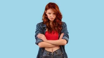 Discontented Millennial Girl Sulking Crossing Hands Standing On Yellow Background. Panorama, Studio Shot photo