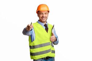 Happy Builder Pointing Pencil At Camera Holding Folder Standing On White Studio Background. Building Career And Employment. photo
