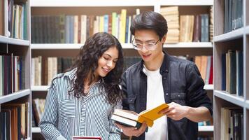 Student Exchange Program. Two multiracial students standing in university library, reading books, copyspace photo