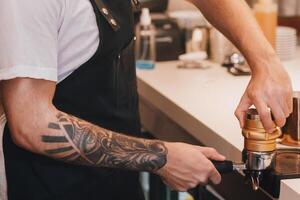 Barista Man Making Coffee Using Coffee-Machine Working In Coffeeshop. Own Cafe Business And Occupation photo