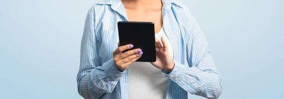 Woman In Face Mask Using Tablet Computer Browsing Internet Reading Coronavirus News Standing On White Studio Background photo