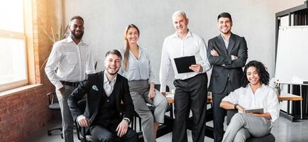 Dream Team. Group Of Successful Business People Smiling To Camera Posing At Workplace In Modern Office. photo