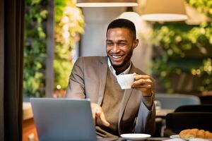 Coffee Break In Cafe. Millennial black man working in cafeteria, using laptop, holding cup, empty space photo
