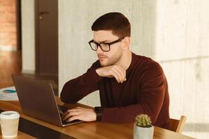 Office Manager Man Working On Laptop Computer Sitting At Desk At Workplace. Business Career photo