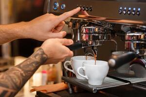 Unrecognizable Barista Preparing Espresso Using Coffee-Machine Working In Coffee Shop. Closeup, Cropped photo