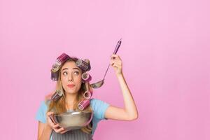 Multitasking woman at home tasting from from a bowl, free space photo