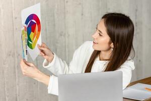 Remote work concept. Designer demonstrates color swatch, free space photo