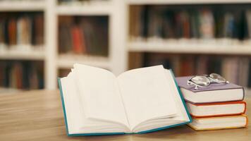 Educational Concept. Close up of opened book with bookshelf in the background, selective focus, copyspace, mock up photo