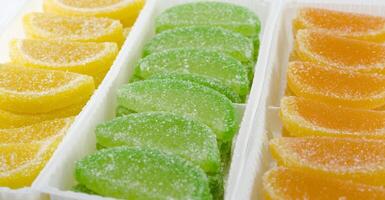 colourful fruit candies in boxes photo
