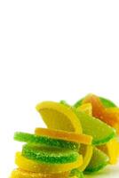 fruit candies on white photo