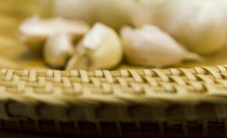 basket and garlics out of focus photo