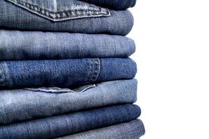 stack of blue jeans photo