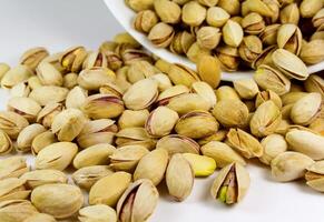 pistachios from bowl photo