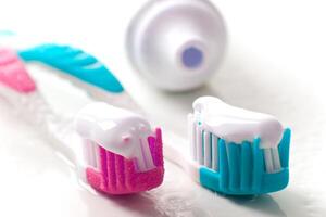 toothpaste and toothbrushes photo