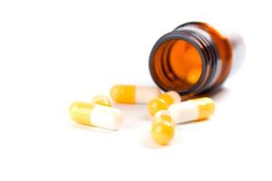 bottle with yelllow capsules photo