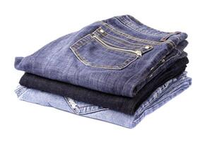 stack of blue jeans photo