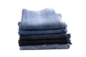 stack of blue jeans photo